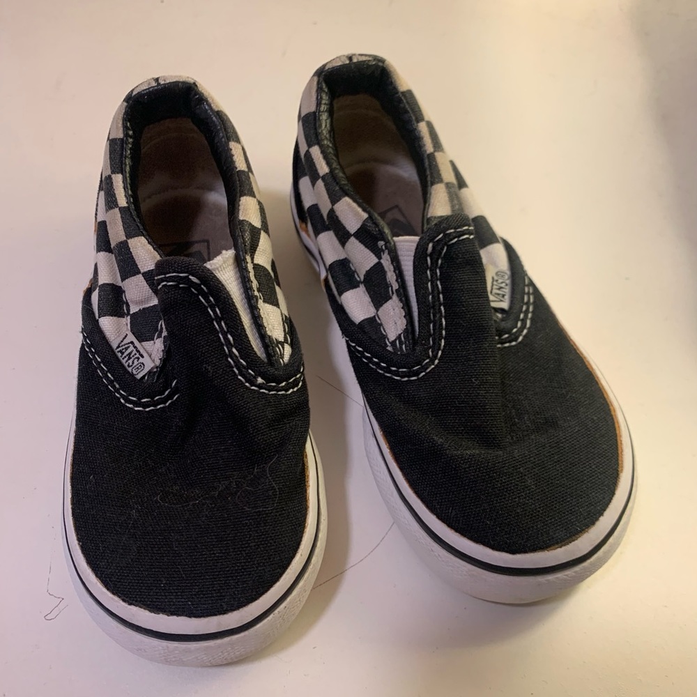 Checkered Vans slip ons